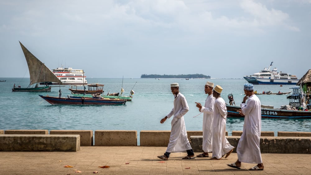 Locals walking in stone town aqrdt0