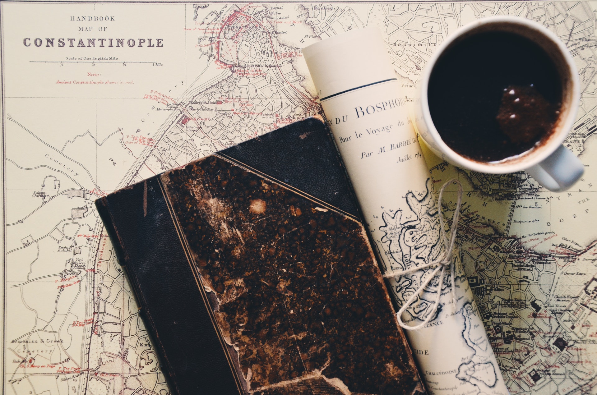 hero image - a map, a diary and a cup of coffee
