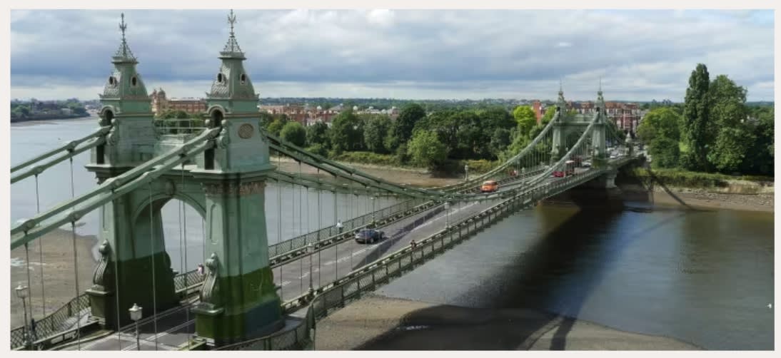 Hammersmith Bridge over the Thames, a green Victorian suspension bridge opened in 1887