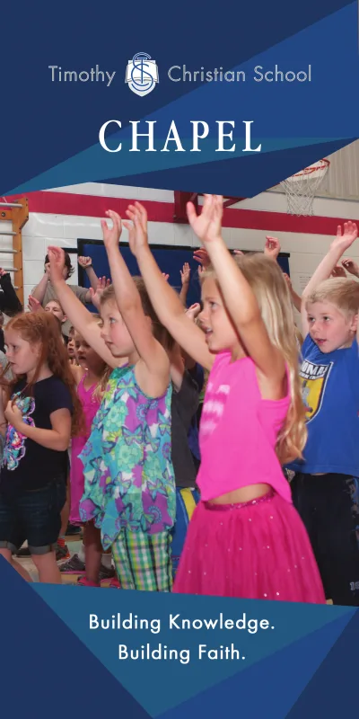 Chapel Banner:  Students are raising their hands and singing in chapel.