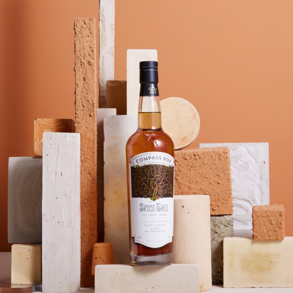 Whisky bottle surrounded by textured wood