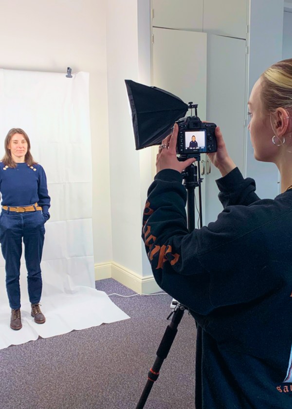 A woman taking a picture in office studio