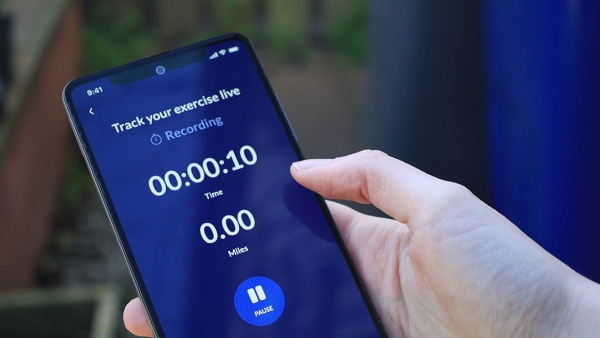 Person holding phone with Doddie Aid app tracking excersie time