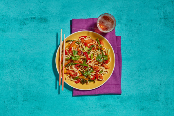 A plate of food with chopsticks, perfect for a delicious and elegant dining experience.