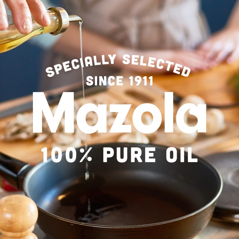 The Mazola logo against a frying pan with oil