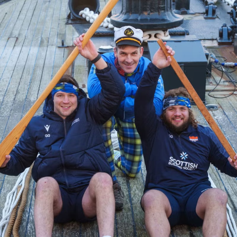 Grant Gilchrist, Rob Wainwright and Pierre Schoeman posing with rowing paddles