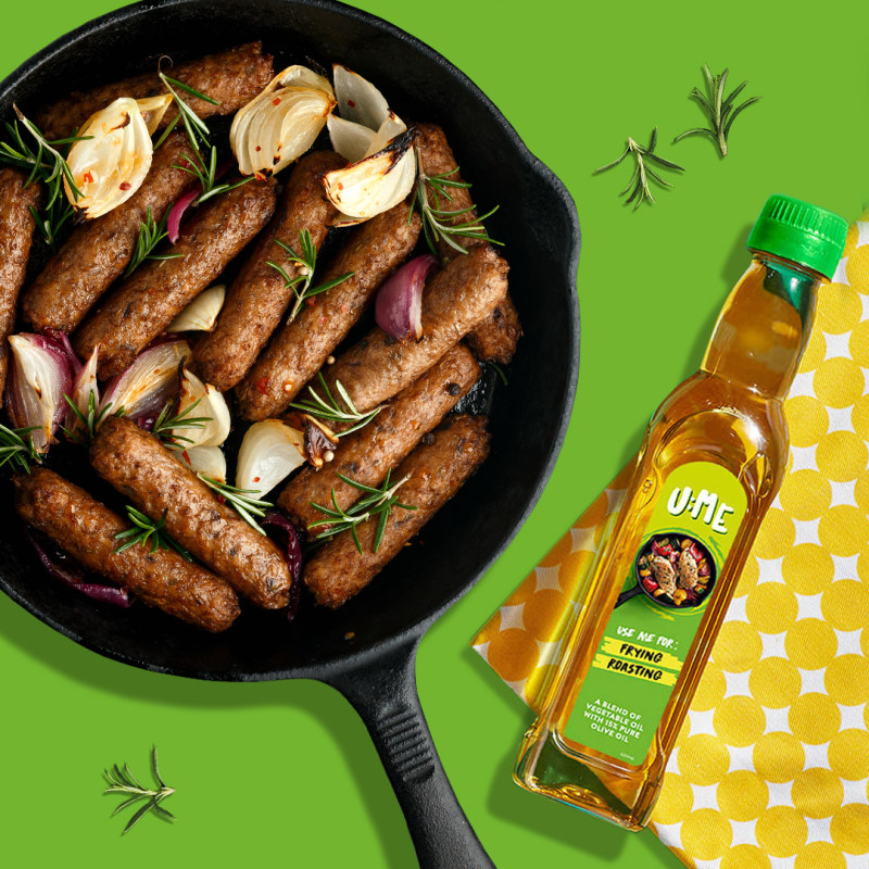 A social media post showing sausages in a frying pan alongside U:ME vegetable and olive oil