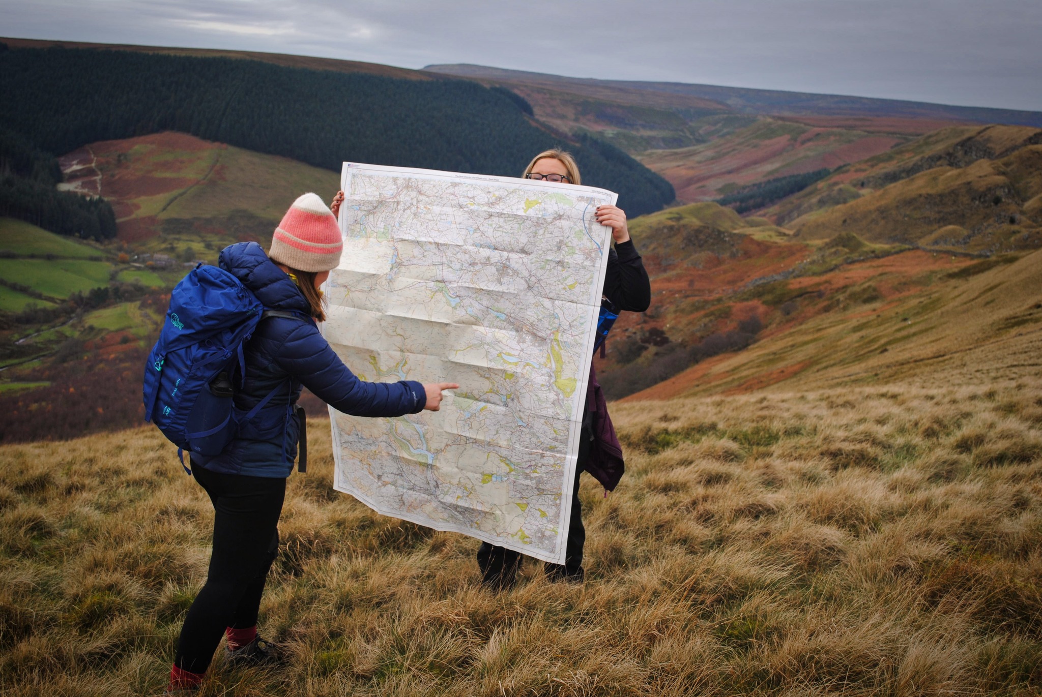 Map and compass on outdoor terrain