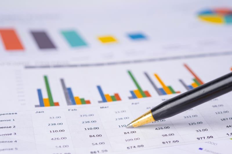 Financial documents and calculator representing ZacFinance CFO services