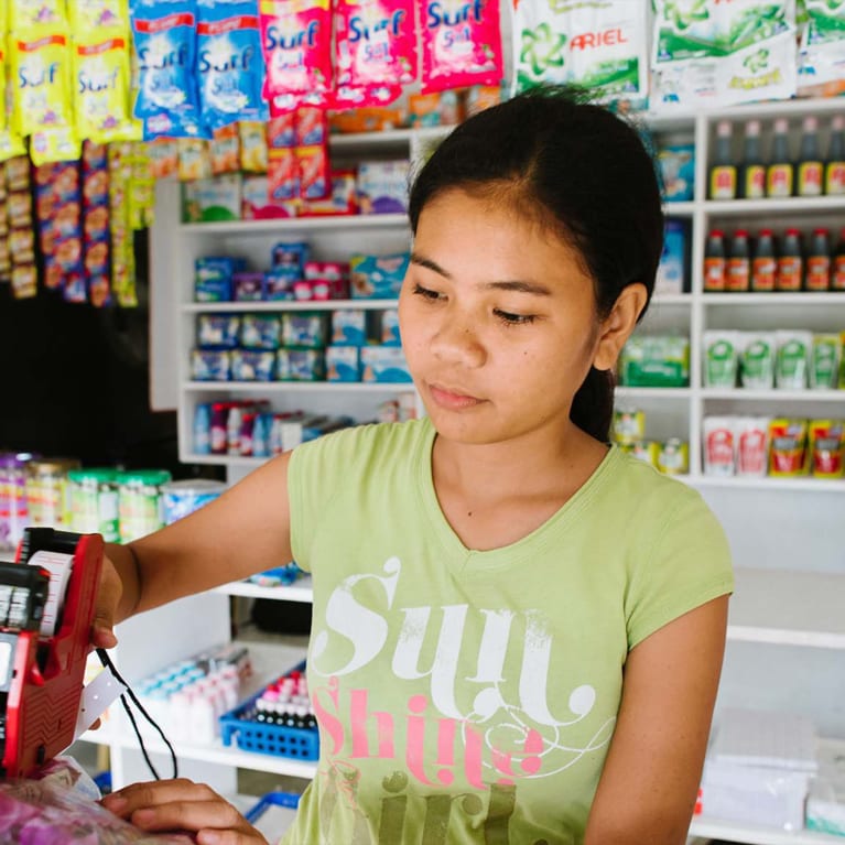A young person working in a shop. Photo: Tom Price/Integral Alliance
