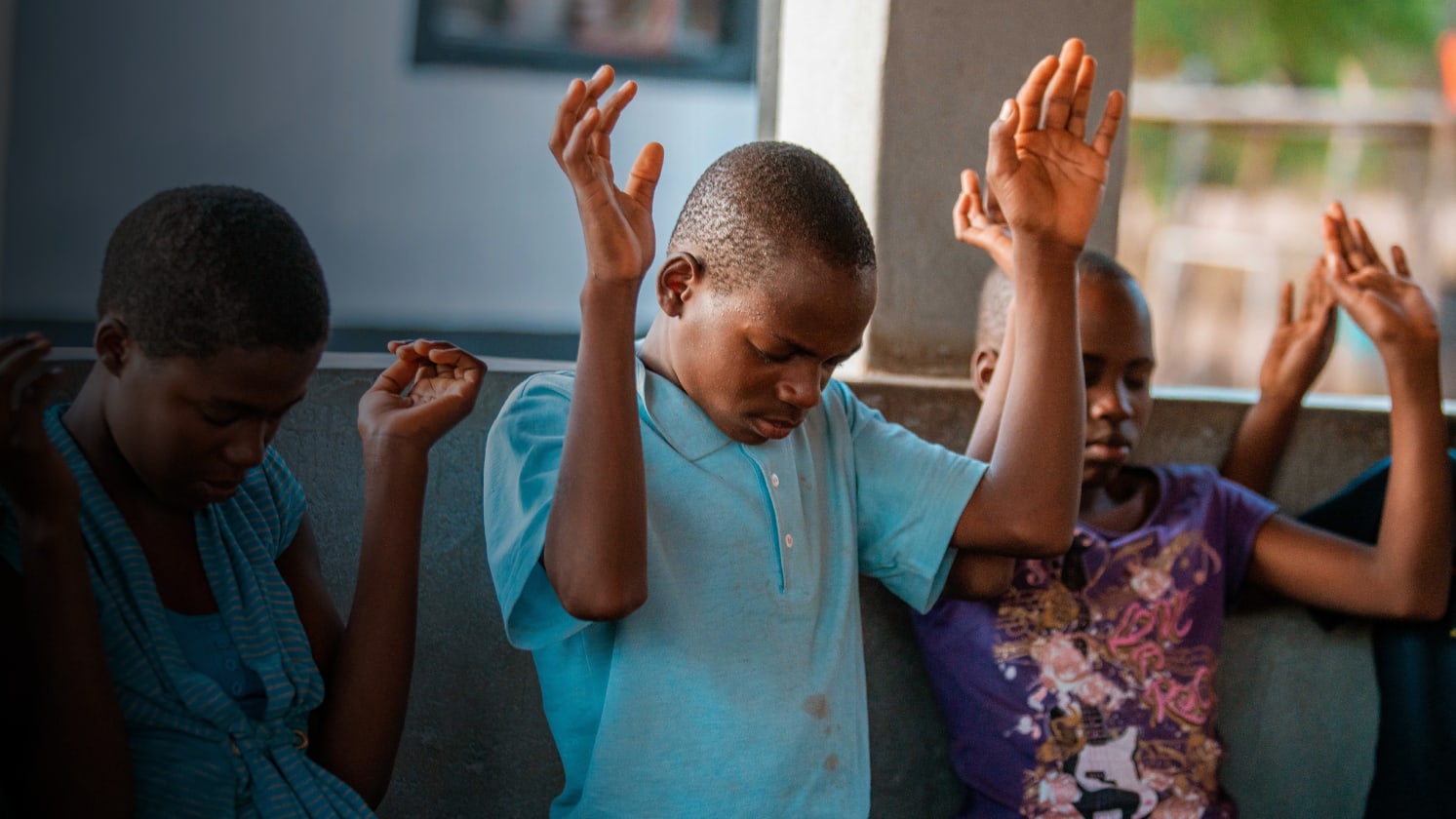 Photo of children worshipping