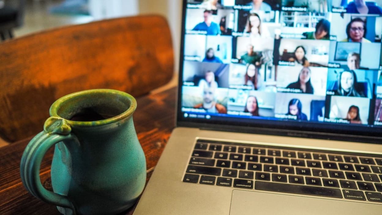 Laptop showing video call (Unsplash)