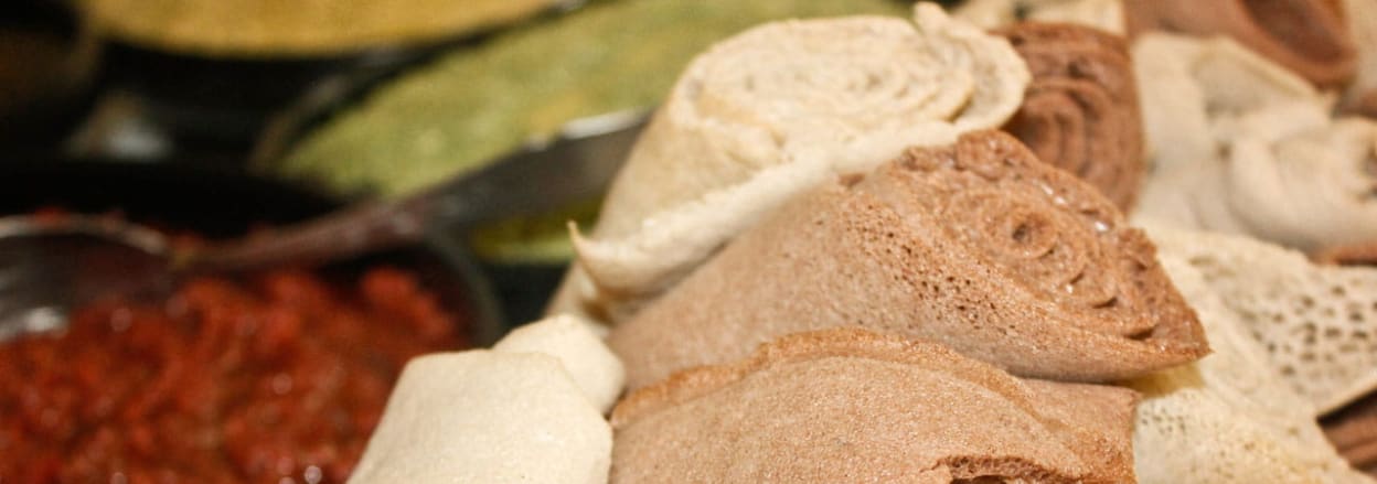 Injera bread rolled up with other Ethiopian foodstuffs