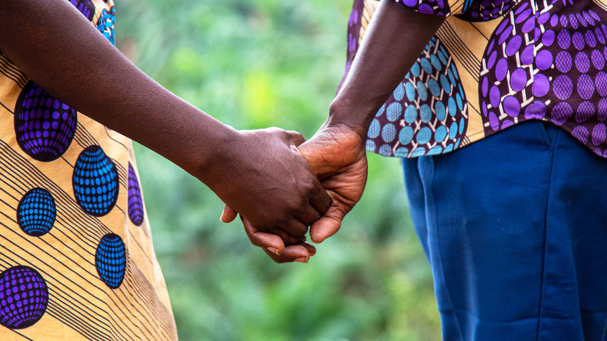 A man and woman holding hands.