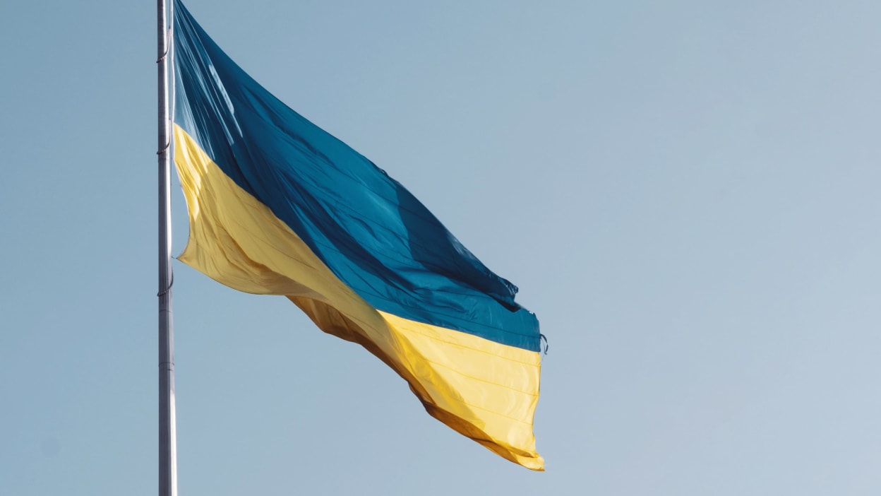 The Ukrainian flag hanging from a flag pole