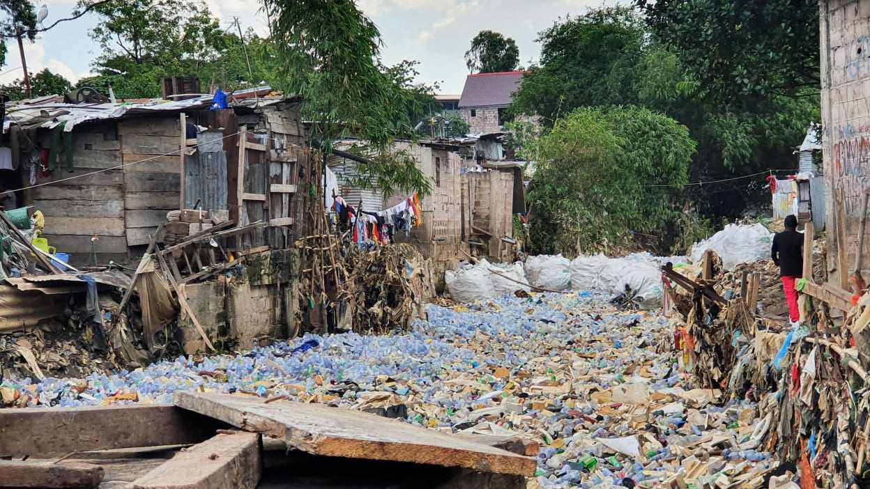 A road filled with plastic waste after heavy rains in Kinshasa, the capital city of Democratic Republic of Congo (DRC)