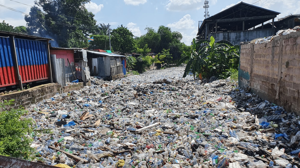 The plastic in tihis river in Kinshasha in the Democratic Republic of Congo has completely choked the waterway.