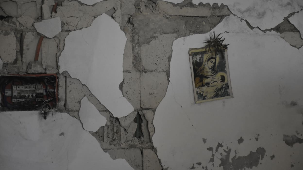 A picture Mary and baby Jesus hangs on a damaged wall in a church in Syria. The local church has been a part of the response in the aftermath of the Turkey-Syria earthquakes on 6 February 2023.