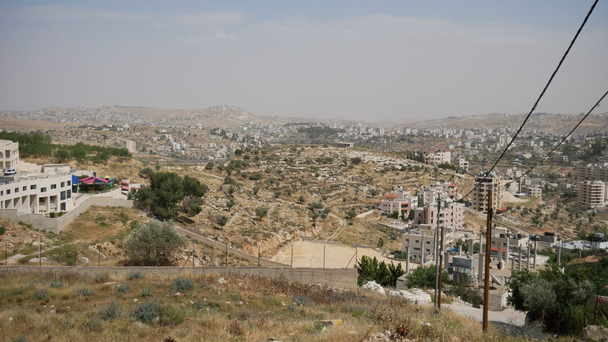 Cityscape of Occupied Palestinian Territory, seen from a hilltop.