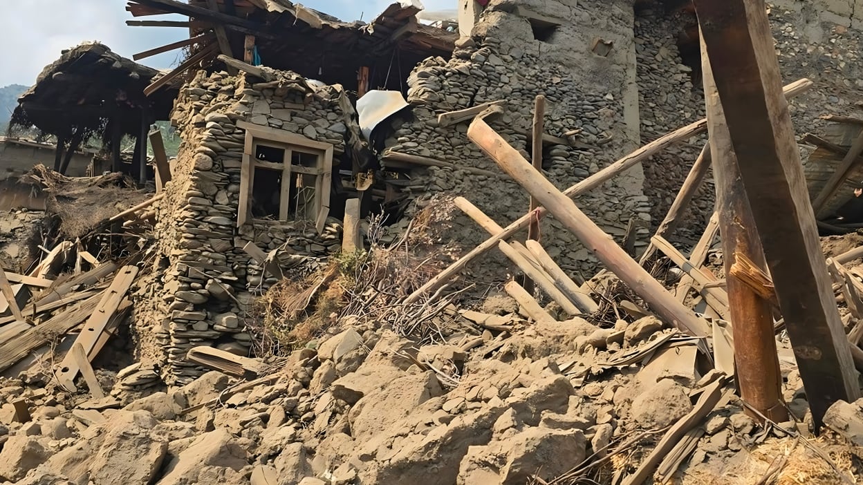A house that has been destroyed with lots of rubble in the foreground.