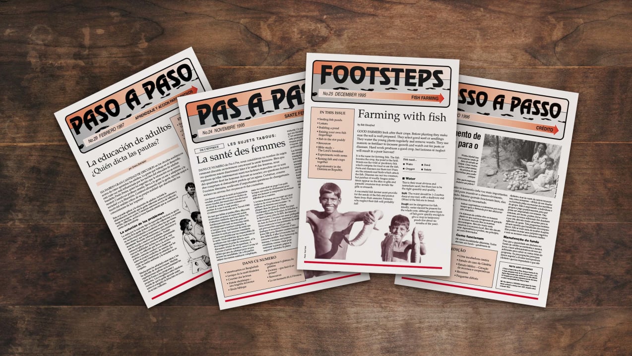 Footsteps magazine issues on a wooden desk.