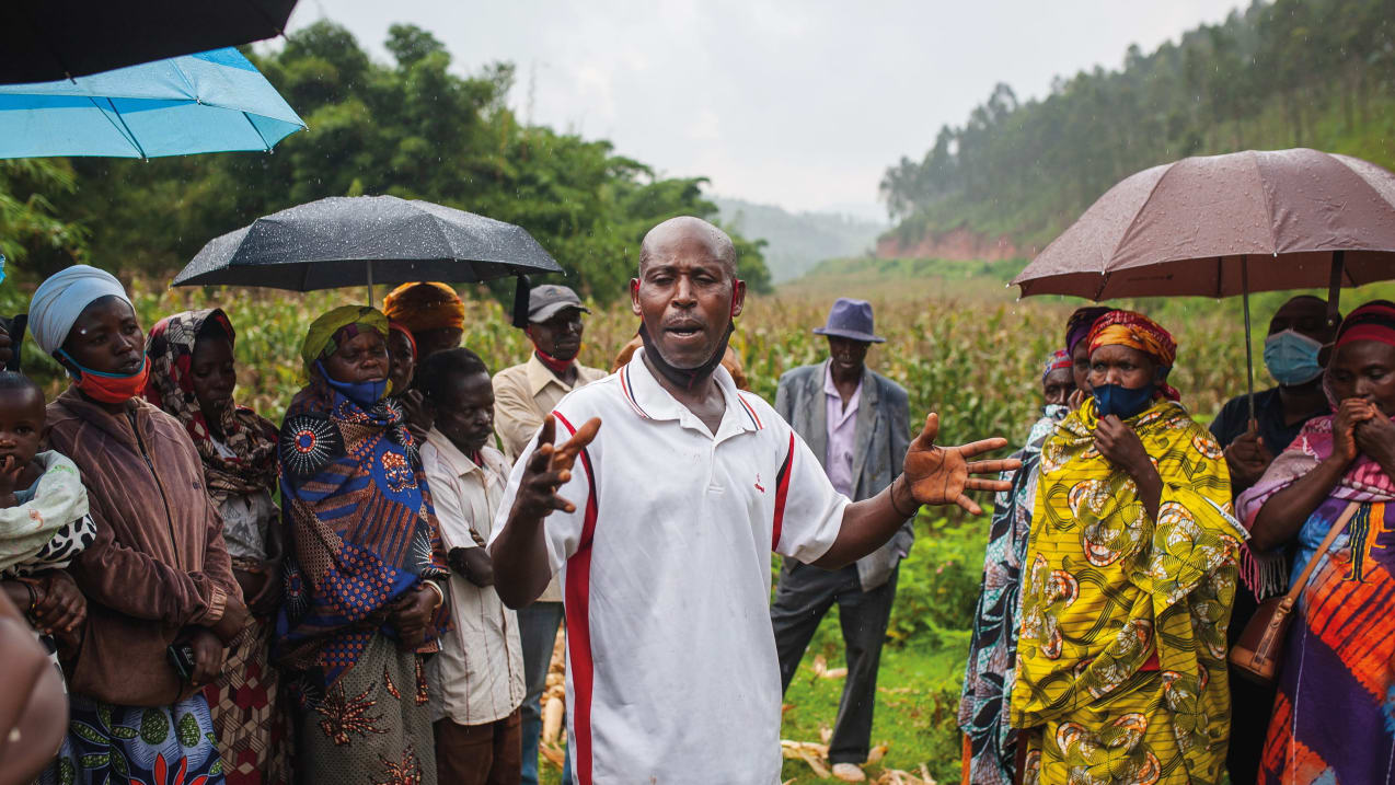 Jean Batiste sharing his testimony of how CCT changed his life at a community meeting in Rwanda. Credit: Pete Dawson/Tearfund