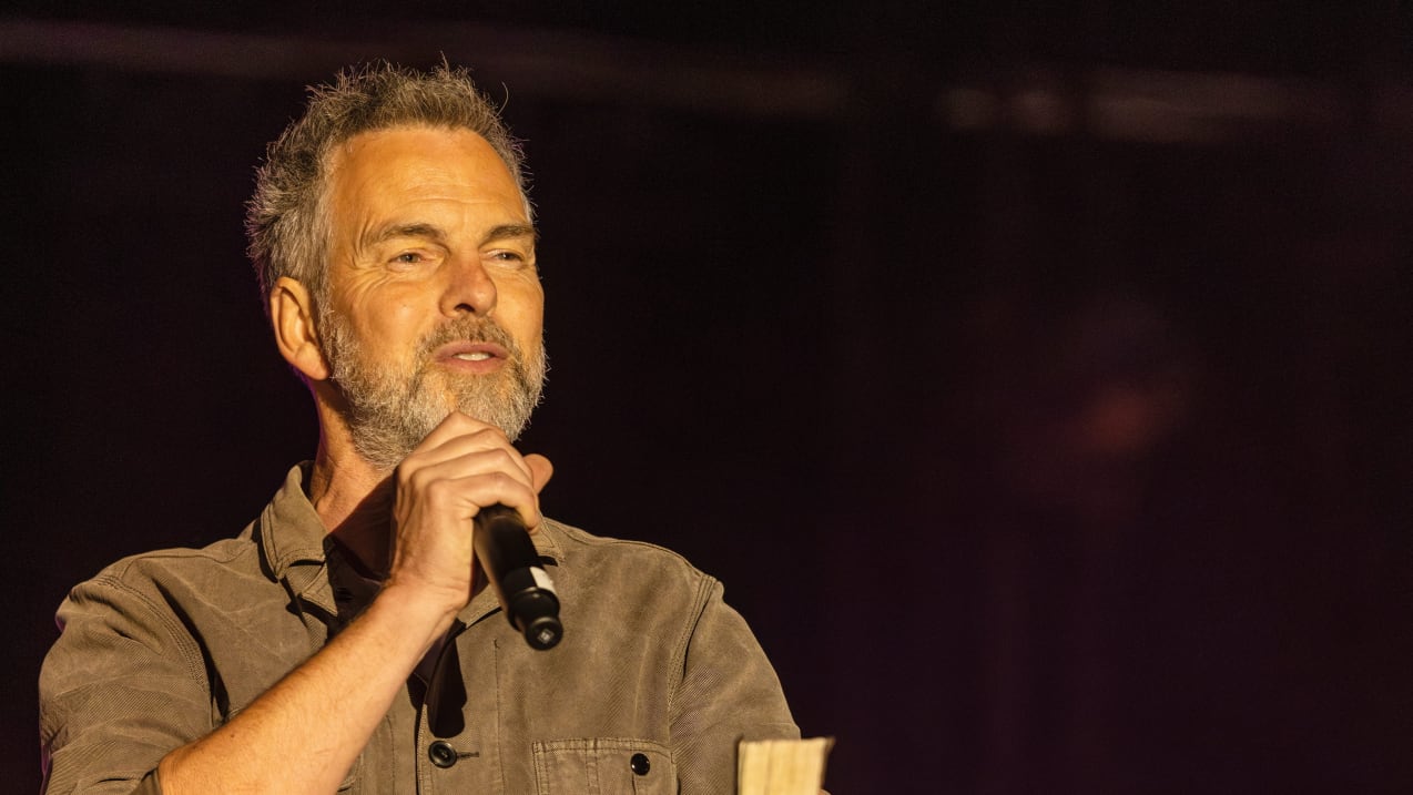 A man speaking into a microphone