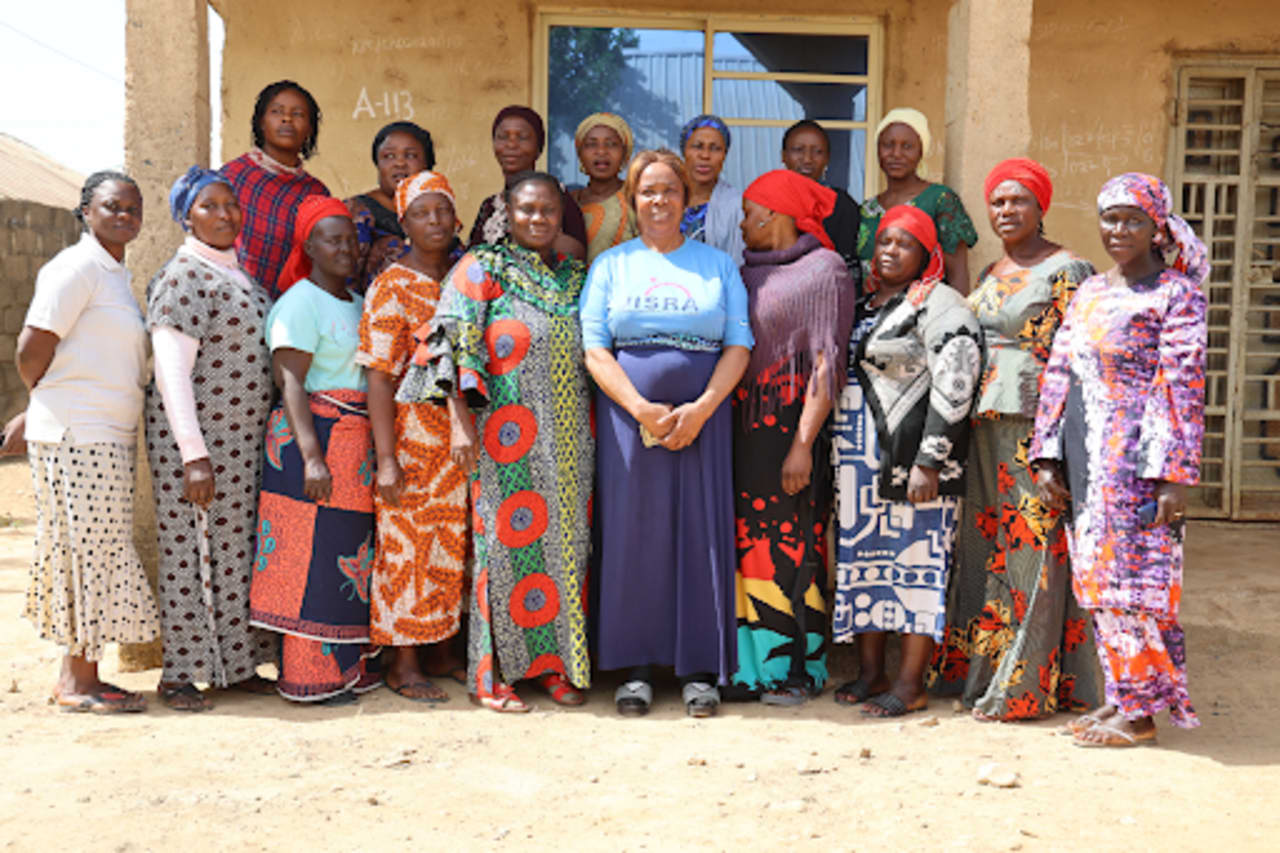 Group of female leaders in front of a building
