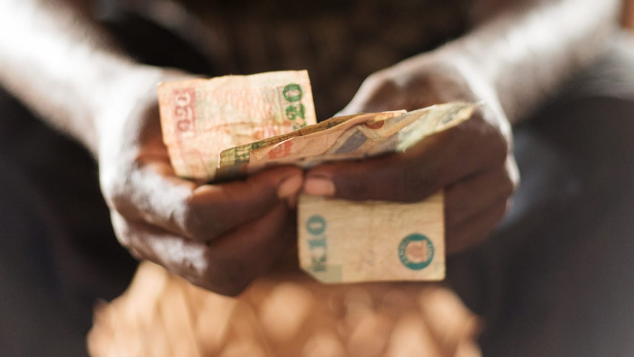 Cash being counted at a self help group meeting.