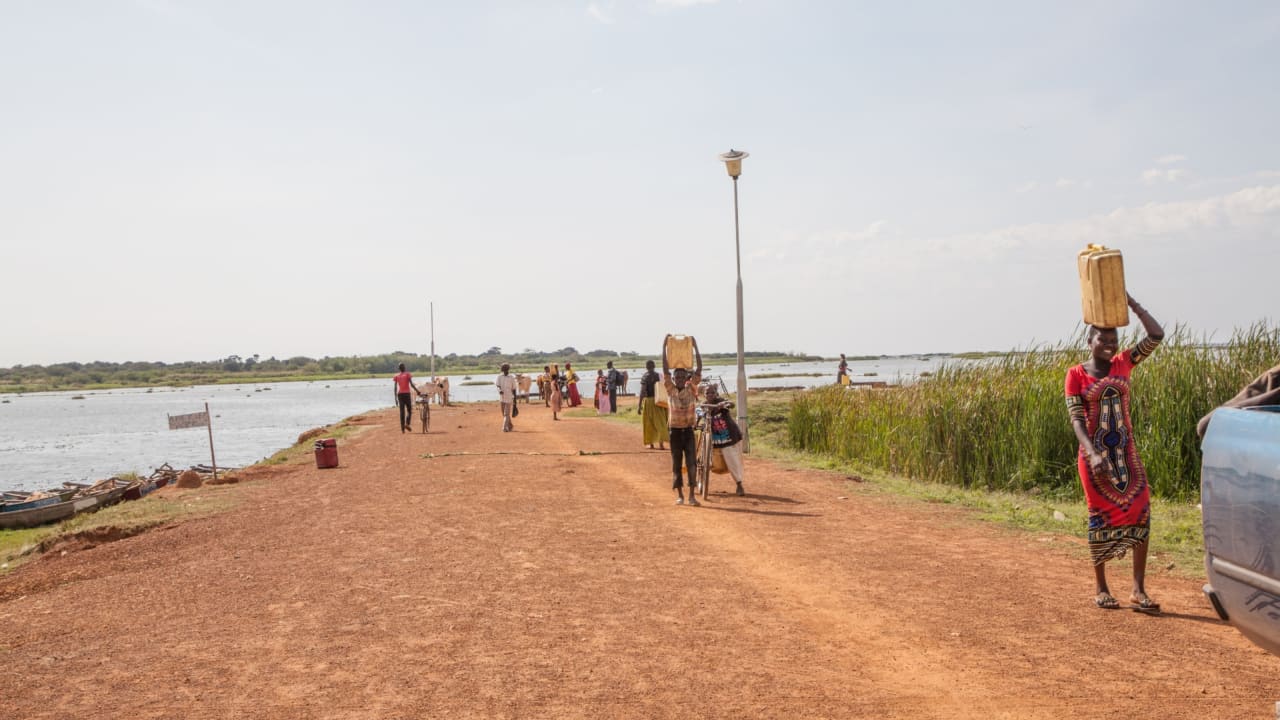 Women collecting water for washing from Lake Kyoga, Uganda. Women have primary responsibility for water collection.