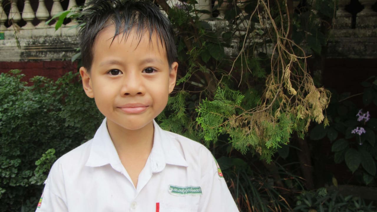 A young boy from Myanmar who could benefit from solar energy for lighting to enable after-school study.