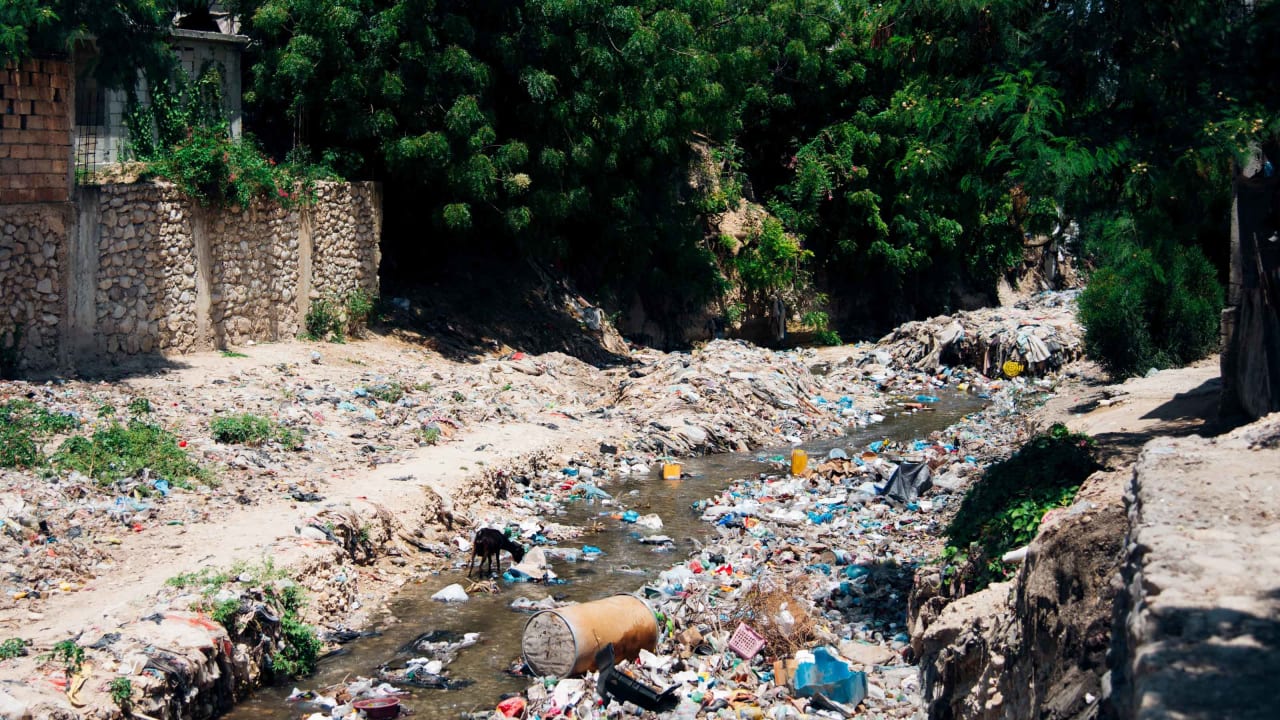 Plastic waste in a river.