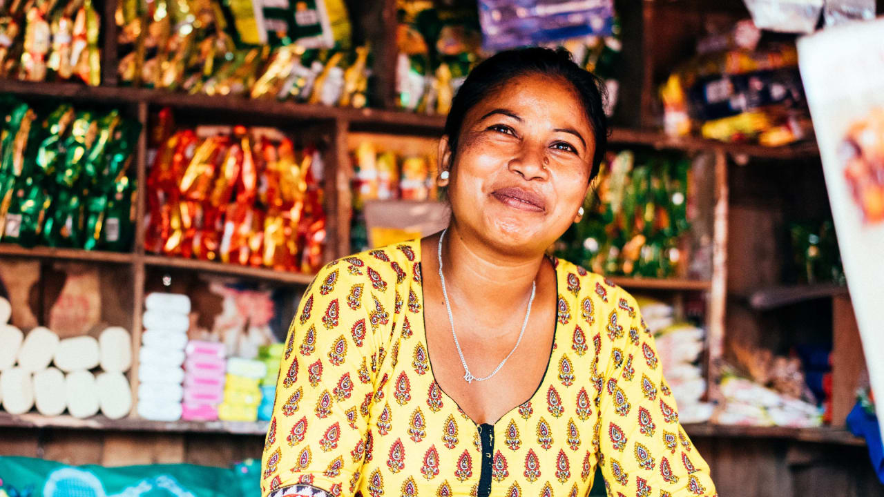 A Nepalese lady behind the counter of her store