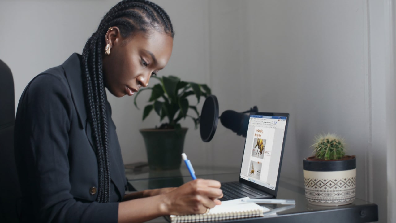 A woman works on her laptop