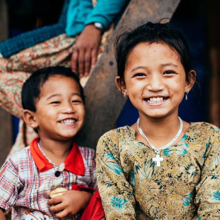 Two children smiling