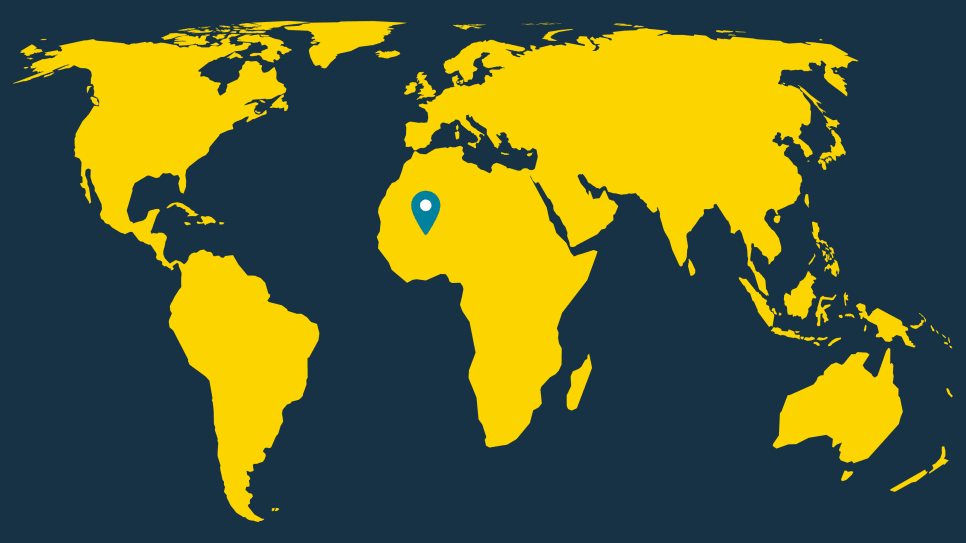 World map in yellow with a turquoise location pin on Mali in West Africa, against a dark blue background.