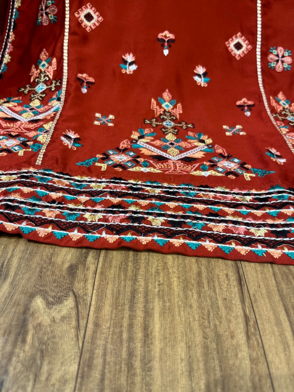 Elegant rust colour embroidery suit featuring intricate multicolor thread work on the neckline, daman, sleeves, and plazo border paired with a beautifully printed dupatta for a rich festive and party wear look.-2