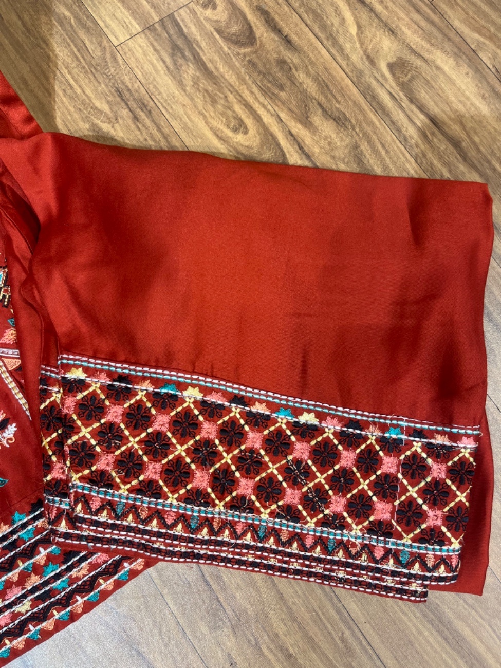 Elegant rust colour embroidery suit featuring intricate multicolor thread work on the neckline, daman, sleeves, and plazo border paired with a beautifully printed dupatta for a rich festive and party wear look.-3