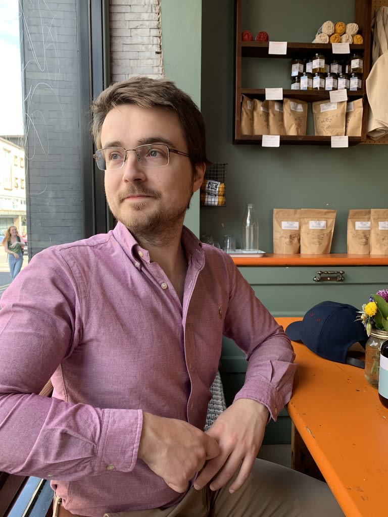 Jose in a coffee shop in Glasgow