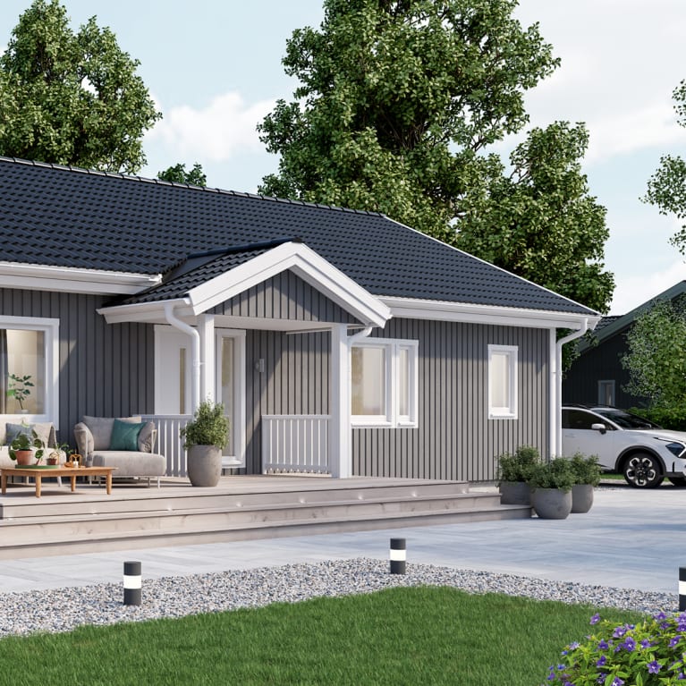 A house with a porch and a lawn.
