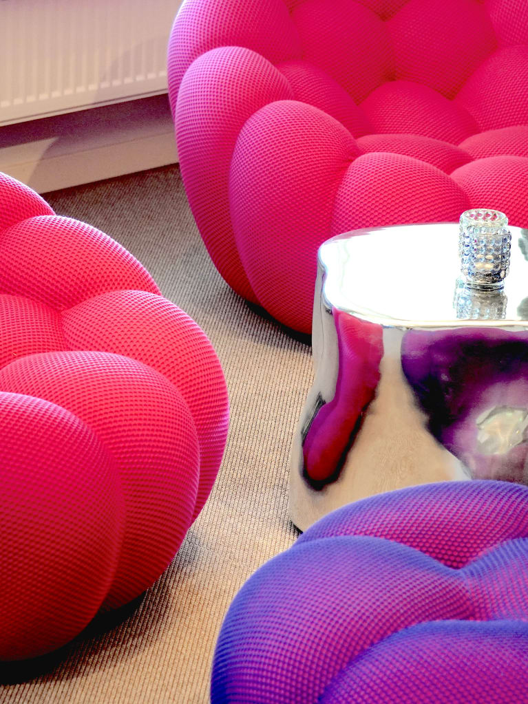 A group of red and purple chairs.