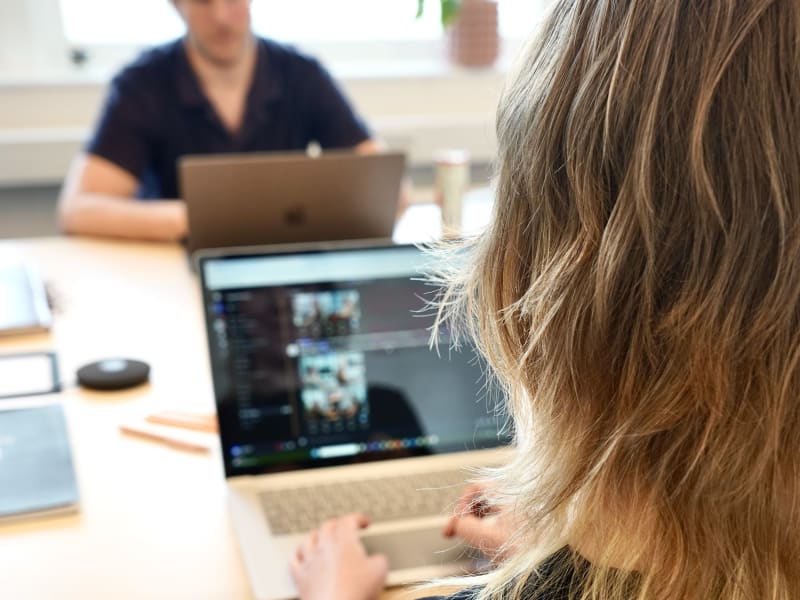 A person using a laptop.
