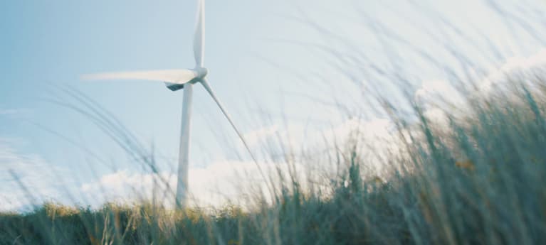 A windmill in a field.
