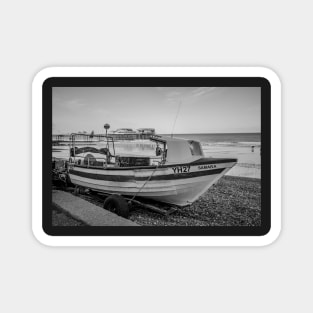 Traditional fishing boat on Cromer beach with the Victorian pier in the background Magnet