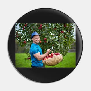 Farmer picking apples in a basket Pin