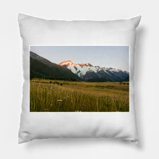 Mount Cook National Park at daybreak as rising sun strikes peaks of surrounding mountains Pillow