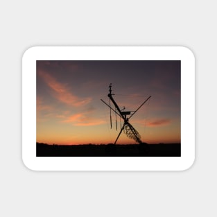 Kansas colorful Sunset with an Irrigation System Silhouette with cloud's. Magnet