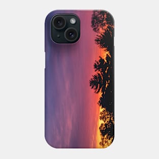 Sunrise over trees Phone Case