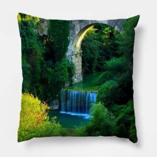 View of Cecco Bridge in Ascoli Piceno with waters of Castellano river flowing below and vegetation Pillow