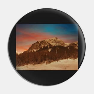 Sunset over the snowy mountains Pin